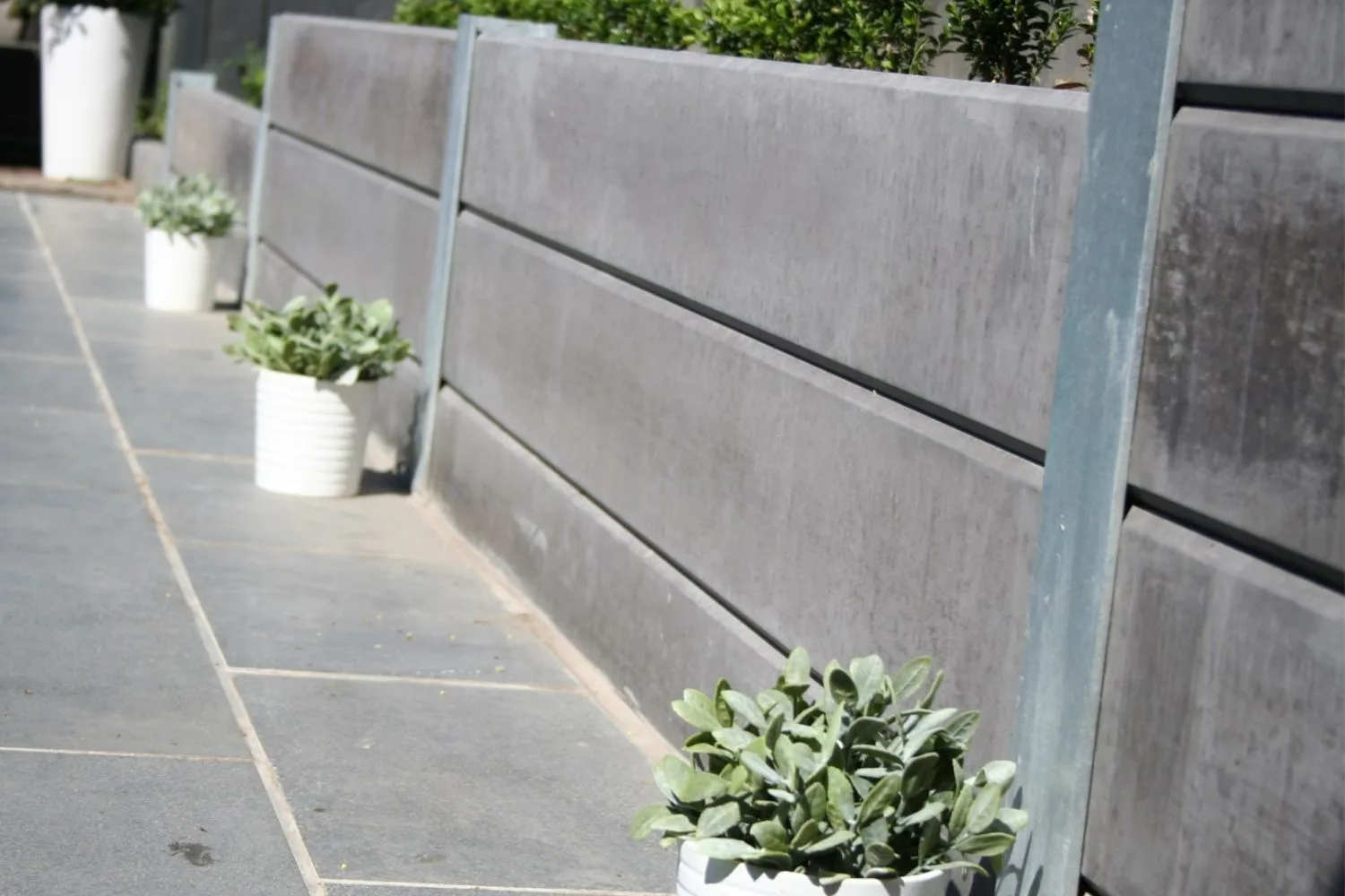 Concrete sleeper retaining wall on a sloped block